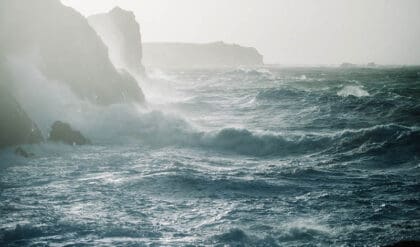 A beautiful scenery of Atlantic Ocean sea waves crashing over rock formations
